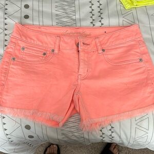 Neon coral AE Jean shorts